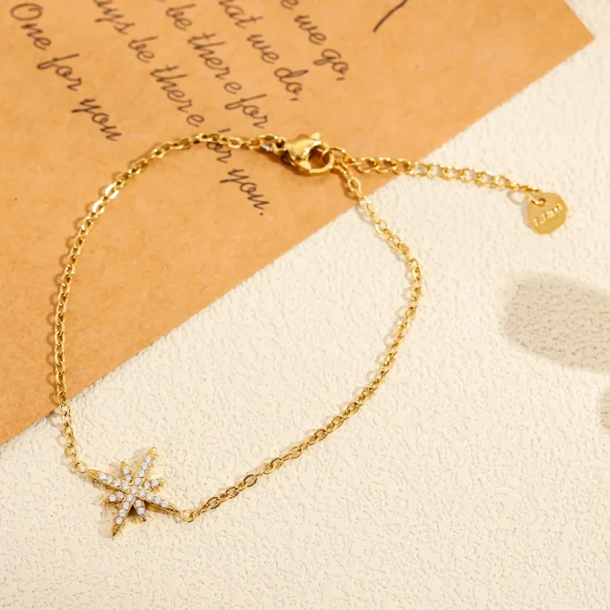 Bracelet orné d' étoile pavée de strass argent ou doré 