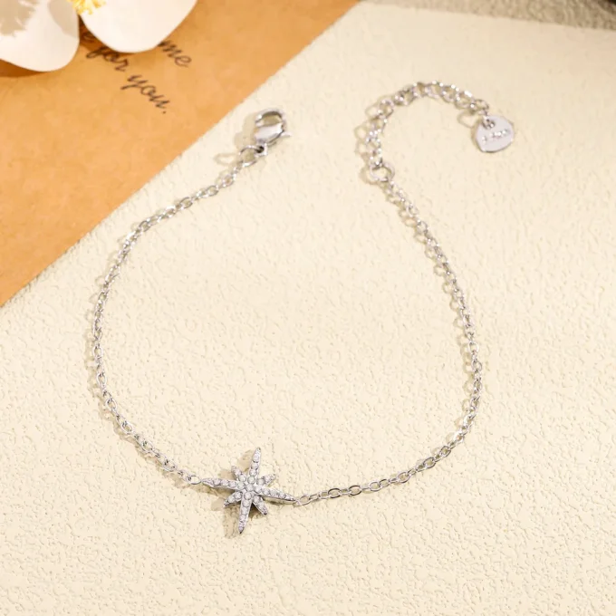 Bracelet orné d' étoile pavée de strass argent ou doré 